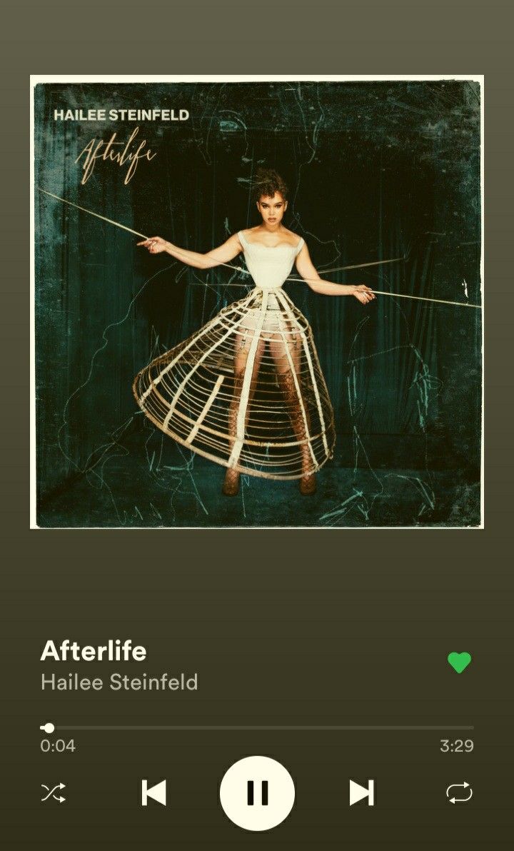 an mp3 player with the words afterlife on it's screen and a photo of a woman in a white dress