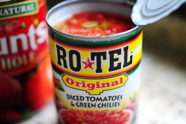 a can of tomato soup with a spoon in it