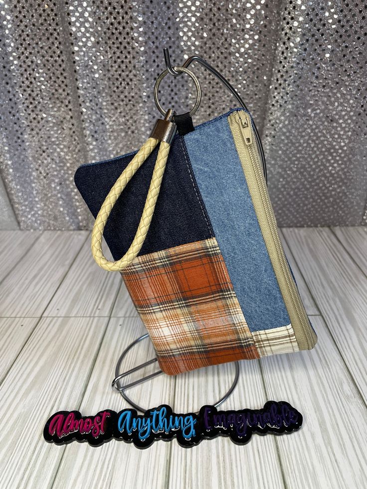 Trendy Block Pattern Wristlet with Jean back.    Comes with a PU Leather woven keychain. Size: 3x5 Casual Rectangular Wristlet For Daily Use, Casual Rectangular Wristlet With Zipper Pouch, Handmade Rectangular Wristlet For Everyday Use, Casual Wristlet With Zipper Pouch For Everyday Use, Casual Everyday Wristlet With Zipper Pouch, Casual Daily Use Wristlet With Zipper Pouch, Handmade Trendy Wristlet For Everyday Use, Trendy Handmade Wristlet For Everyday, Adjustable Wristlet With Zipper Pouch For Daily Use