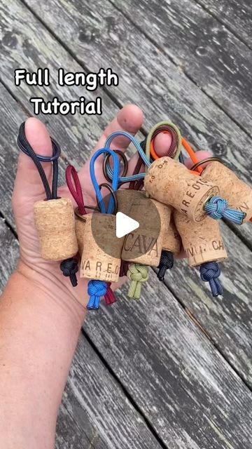 a person holding several corks with the words, full length tutor written on them