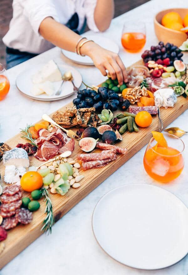 a table topped with plates and bowls filled with food