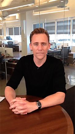 a man sitting at a table in an office