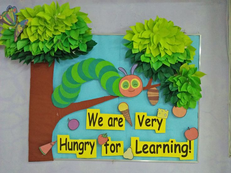 the very hungry caterpillar bulletin board is decorated with paper flowers and leaves to help students learn