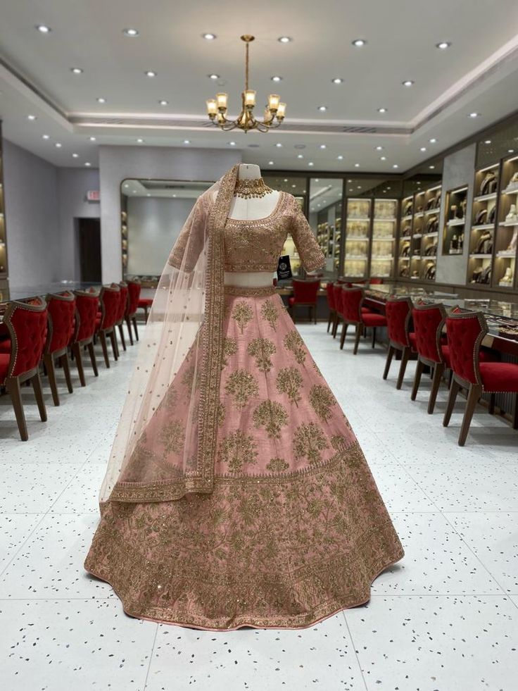 Indulge in the opulence of our Blush Pink Bridal Lehenga BL-110. This exquisite lehenga features a stunning blush pink color that exudes romance and elegance. Crafted with the finest materials, this lehenga is the embodiment of luxury and sophistication. Elevate your bridal look with this exquisite piece. Fabric: Raw Silk! WASH CARE INSTRUCTIONS - Please Dry clean only when it is applicable! Ready to Ship! Pink Saree Choli For Wedding, Wedding Pink Choli With Pallu, Wedding Pink Lehenga With Resham Embroidery, Pink Reception Lehenga With Traditional Drape, Pink Lehenga For Reception With Traditional Drape, Pink Dori Work Gown For Wedding, Traditional Drape Pink Lehenga For Reception, Pink Wedding Gown With Zari Work, Bollywood Style Pink Choli For Wedding