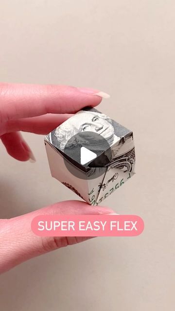 someone is holding a money origami box with the words super easy flex on it