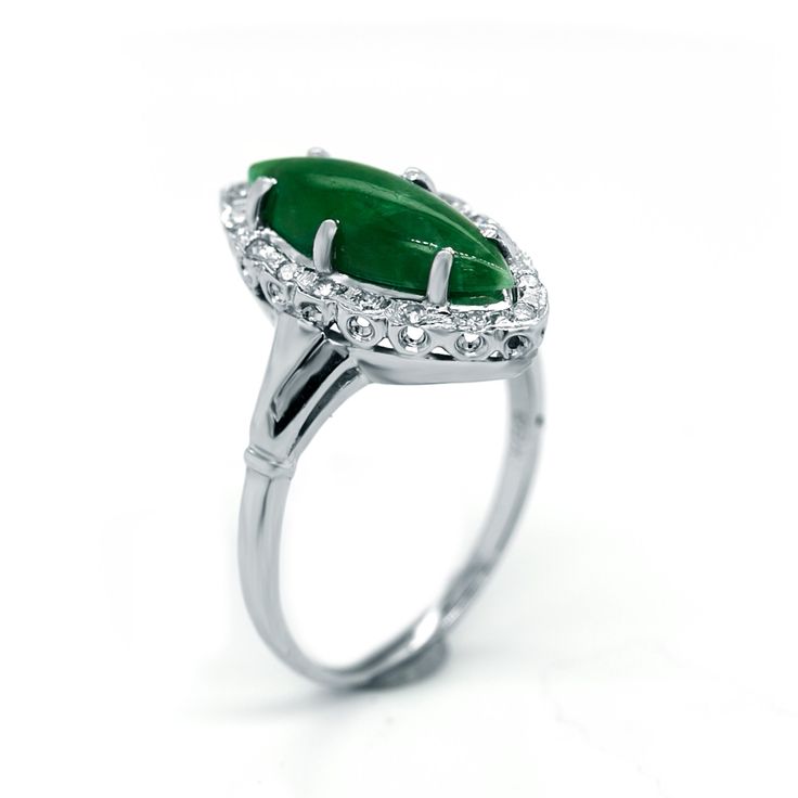 This ring has a gorgeous green natural cabochon marquise cut Green Jade. It is the perfect statement ring for everyday wear. It is made in 14 karats of white gold. [MATERIALS] Stone: Jade (1) Carat: Approx.2.50 Color: Green Cut: Cabochon marquise Clarity: Slight imperfections Setting: Prong Measurement of the stone: 17.50 mm X 8.0 mm Metal: 14 karats white Gold, 6.0 grams Measurement of the Band: 5.0 mm [ORDERS] All items that are made to order take about 7-12 days to create and ship. [CUSTOM OR Green Marquise Diamond Ring Fine Jewelry, Green Marquise Emerald Diamond Ring, Green Marquise Emerald Rings, Marquise Emerald Diamond Ring In Green, Green Marquise Diamond Ring, Marquise Emerald Ring For May Birthstone, Marquise Emerald Ring With Center Stone, Green Gemstone Ring With Marquise Cut, Green Marquise Emerald Ring For Anniversary