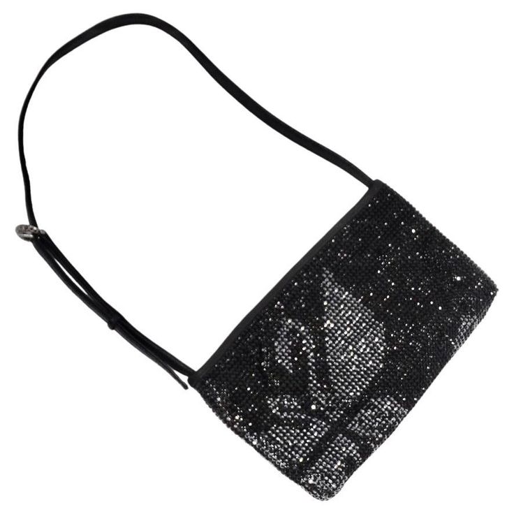 Do not miss out on this rare Swarovski embellished handbag! Classic black mini shoulder bag is covered in Swarovski rhinestones and features an adjustable buckle strap which allows for versatility with wear. The focal point of the handbag is the gorgeous silver swan motif embellished at the center it really takes this handbag up a notch and adds a classic and glamorous Swarovski touch. This is such a show-stopping handbag that is sure to be catching eyes from across the room wherever you wear th Evening Rhinestone Crossbody Bag, Formal Crossbody Shoulder Bag With Rhinestones, Formal Rhinestone Crossbody Shoulder Bag, Evening Rhinestone Crossbody Shoulder Bag, Evening Shoulder Bag With Rhinestones Crossbody, Luxury Black Rhinestone Shoulder Bag, Formal Embellished Shoulder Bag, Black Rhinestone Shoulder Bag For Events, Embellished Black Evening Shoulder Bag