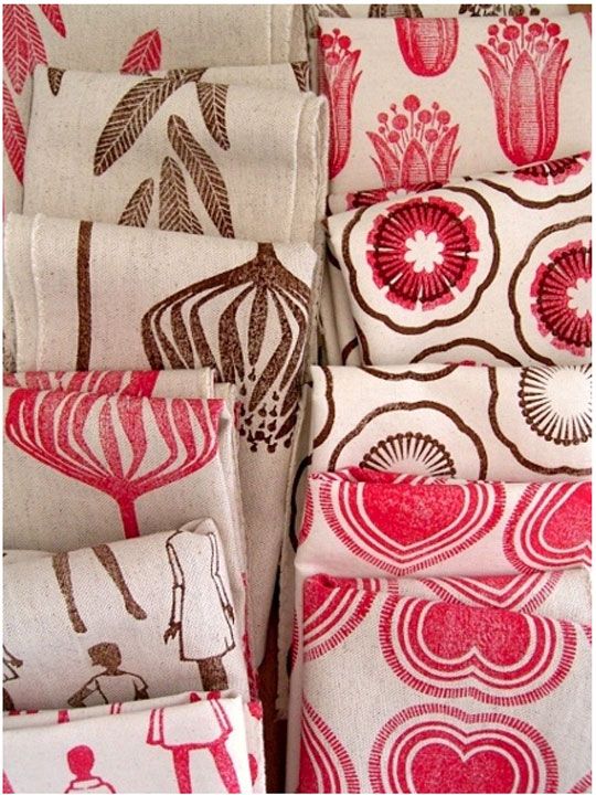 red and white fabric with different designs on it