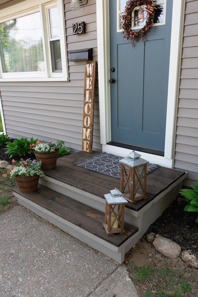 the front porch is decorated with flowers and candles