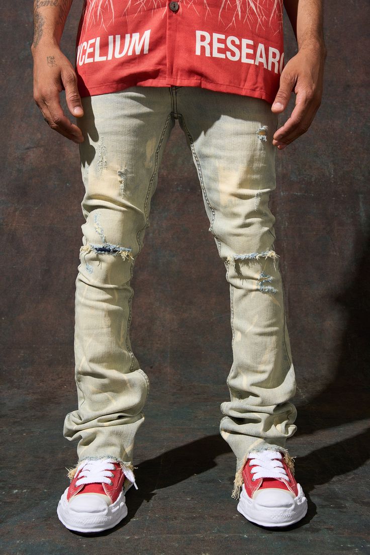 SERENEDE® "SULFUR" stacked jeans feature a light blue wash with bleached accents, a fitted construction, and a stacked finish. Go with your regular waist size. This style fits like our usual sizing with added stack to the bottom of the leg. THIS STYLE IS A STACKED JEAN AND HAS A WIDER LEG OPENING. PLEASE ORDER YOUR USUAL SIZE FOR THIS PARTICULAR LOOSER FIT AROUND YOUR LEGS. DETAILED FEATURES: Stretchability: MEDIUM STRETCH Vintage light blue denim base with bleached fading Distressing throughout Distressed Medium Wash Flare Jeans For Streetwear, Distressed Light Wash Jeans For Streetwear, Light Wash Distressed Jeans For Streetwear, Light Wash Ripped Jeans For Streetwear, Fitted Light Wash Flare Jeans For Streetwear, Urban Style Distressed Light Wash Jeans, Urban Distressed Light Wash Jeans, Light Wash Denim Flare Jeans For Streetwear, Urban Style Ripped Light Wash Bottoms