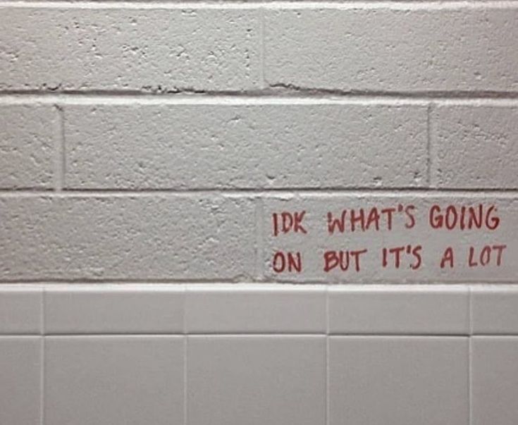 a sign on the wall that says, i do what's going on but it's a lot