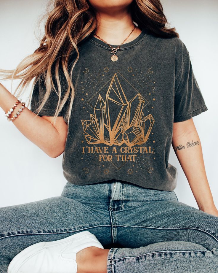 This Comfort Colors Tshirt features the saying I Have A Crystal For That and a beautiful mystical design. This T-shirt would make the perfect gift for the spiritual person in your life. Comes in multiple colors! ✨️SIZE AND FIT: Your shirt will be printed on a high-quality, soft and comfortable unisex t-shirt. Sizes run true to size, which takes the guesswork out of ordering. If you like your t-shirts loose or oversized - size up. For a more fitted women's style - size down. If you are looking fo Spiritual Shirts, Zodiac Shirts, Comfort Colors Tshirt, Moon Shirt, Retro Tee, Concert Shirts, Boho Print, Mom Tees, Vintage Tee