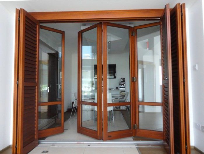 an open wooden door leading into a white room