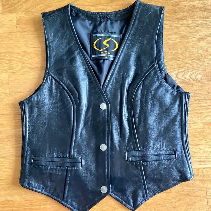 S Collection Women’s Leather Motorcycle Vest Size: M Brand New / Never Worn Classic Leather Vest For Workwear, Black Leather Spring Vest, Black Leather Vest For Spring, Classic Fall Vest With Snap Buttons, Classic Black Leather Vest, Classic Black Vest With Pockets, Holiday Vest, Cardigan Vest Sleeveless, Trench Vest