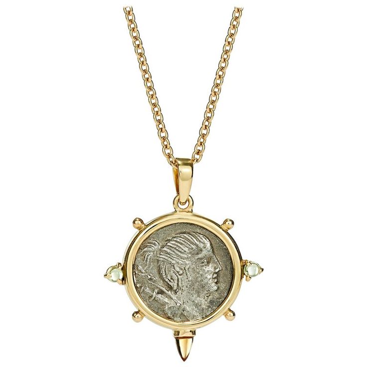 This DUBINI coin necklace from the 'Empires' collection features an authentic Roman denarius silver coin dating circa 74 B.C. set in 18kt yellow gold with peridot and citrine cabochons. Depicted on the coin: Obverse - Bust of Diana right, wearing hair tied into knot; bow and quiver over shoulder. Reverse - Hound running right; hunting spear below. HISTORY Diana, in Roman religion, goddess of wild animals and the hunt, identified with the Greek Goddess Artemis. Like her Greek counterpart, she was Byzantine Style Yellow Gold Necklace With Coin Pendant, Yellow Gold Coin Pendant Necklace In Amulet Style, Luxury Engraved Coin Necklace, Byzantine Style Yellow Gold Medallion Coin Necklace, Hallmarked Yellow Gold Coin Necklace, Antique Yellow Gold Coin Necklace, Byzantine Style Medallion Coin Necklace, Goddess Style Coin Pendant Jewelry, Ancient Style Medallion Necklace In Yellow Gold