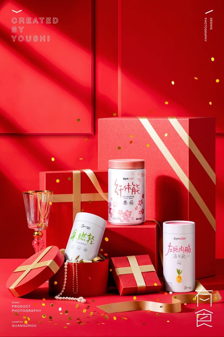 the red box is filled with gifts for someone's special occasion, and there are confetti in it