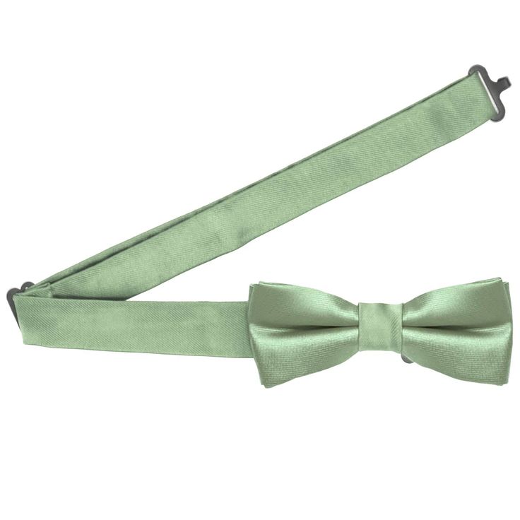 A charming boys' mint green bow tie sized just right for your little guy. Made from heavyweight woven material with slight ribbing. The bow tie is pre-tied and features a safe and easy-to-use hook-and-eye closure. Measuring 4-inches across and 1.5-inches tall, this boys' bow tie is sized for boys from baby to 10-years old. We recommend this shade for a subdued pale green. See it in person by requesting a free color swatch. Sizing This bow tie features an adjustable band that expands to fit most Green Bow Tie, Guy Fits, Green Bows, Color Swatch, Pale Green, Free Coloring, Bow Tie, Mint Green, Mint