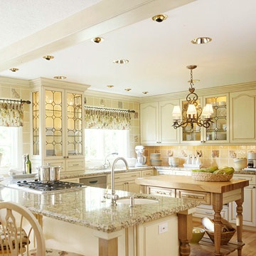 a large kitchen with an island in the middle and lots of counter space around it