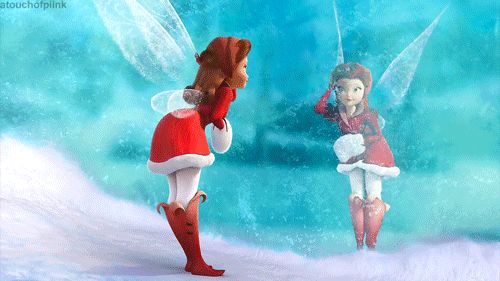 two elves dressed as santa claus and tinkerbells in front of a blue background