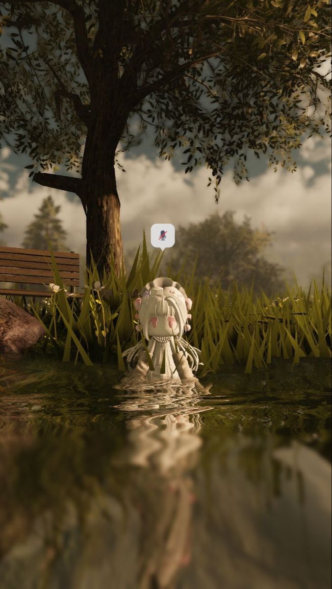 a small white object floating on top of a body of water next to a tree