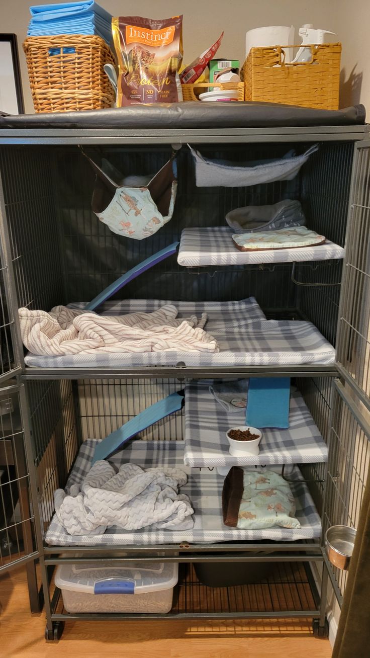 a cage filled with clothes and other items