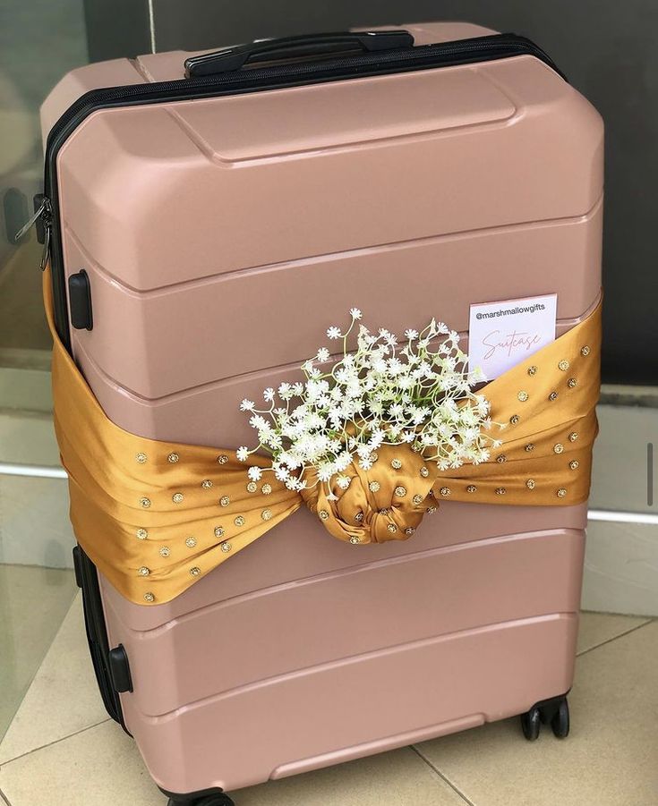 Suitcase wrapped in a gold satin for engagement dowry wrapping. Suitcase Wrapping Ideas, Suitcase Packing For Wedding, Wedding Suitcase Packing, Luggage Gift Wrapping Ideas, Wedding Suitcase Decor, Luggage Decorating Ideas, Suitcase Decoration Wedding, Suitcase Decor Ideas, Bridal Suitcase