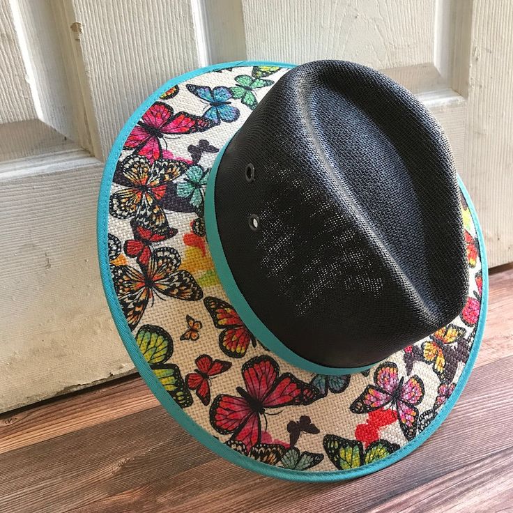 This beautiful Mexican Sombrero has would be perfect to add that special touch to any outfit. MADE IN MEXICO By: Mexican Artisans For: Women Size: Medium 23' Color: black | multi Details: Material: palm straw Fabric canvas design Bottom navy suede Inner elastic band Contact us for more details PLEASE READ BEFORE PURCHASE: The picture is an ACCURATE REPRESENTATION.Colors in the pictures may vary a little by effects of light. Each product is handmade from Mexico causing differentiation and minor i Black Bohemian Straw Hat For Summer, Adjustable Straw Hat For Beach And Cinco De Mayo, Black Wide Brim Hat For Cinco De Mayo, Multicolor Brimmed Fedora For Rodeo, Black Straw Hat For Spring Festival, Adjustable Hats For Cinco De Mayo Vacation, Multicolor Fedora Straw Hat For Kentucky Derby, Black Brimmed Sun Hat For Festivals, Handmade Black Fedora For Rodeo