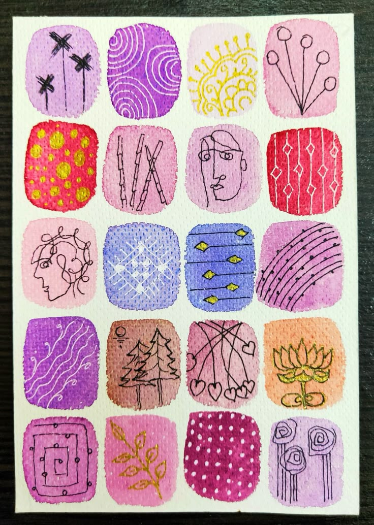 a piece of paper with different colored designs on it