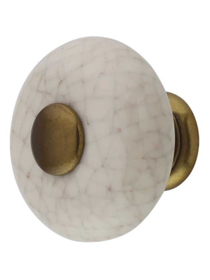 a white marble door knob with gold accents