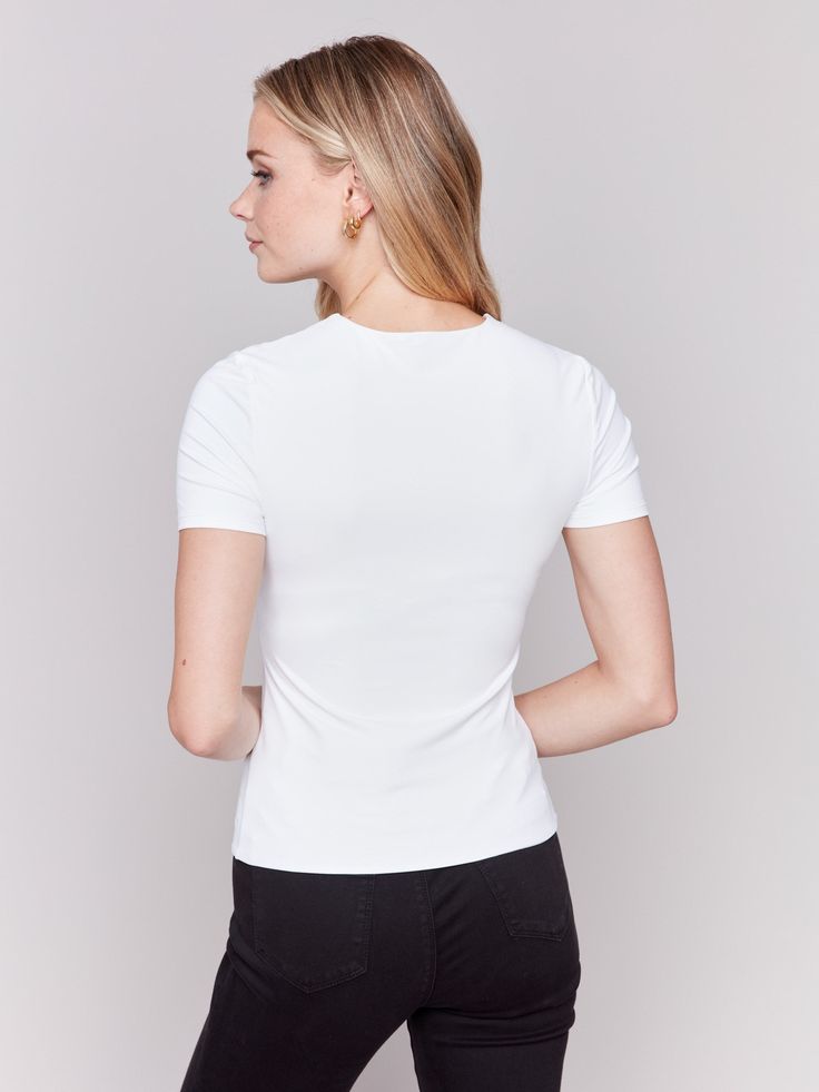 Experience the ideal blend of comfort and elegance with our Short-Sleeved Super Stretch Top. Made from ultra-flexible double layer fabric, this white top offers a comfortable yet form-fitting feel, providing unparalleled freedom of movement. Its minimalist design is perfect for layering or wearing alone for a sleek, polished look. Upgrade your wardrobe with this versatile essential, a true must-have. Slim fit Crew neckline Short sleeves Double layer, stretch fabric Denim Editorial, Linen Jackets, Fall Plaid, Stretch Top, Linen Skirt, Midi Maxi Dress, Crew Neck Top, Knee Length Dresses, Friday Sale