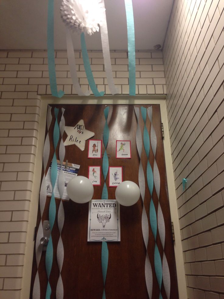 a door decorated with blue and white streamers