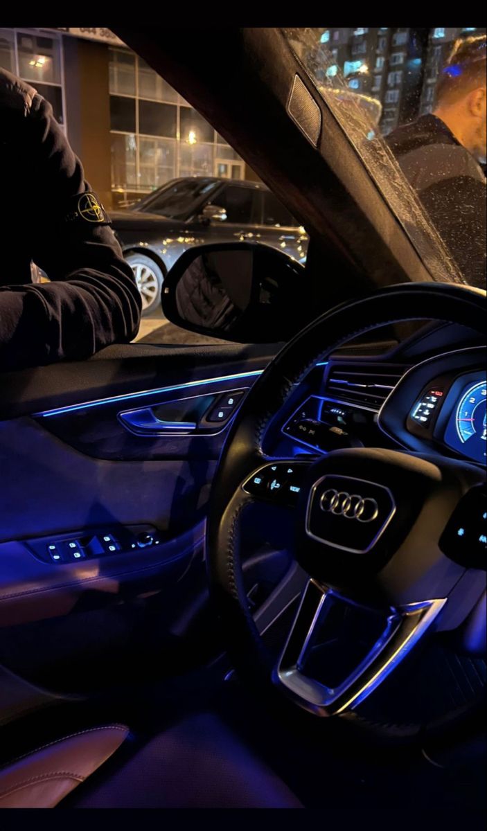 the interior of an audi car at night