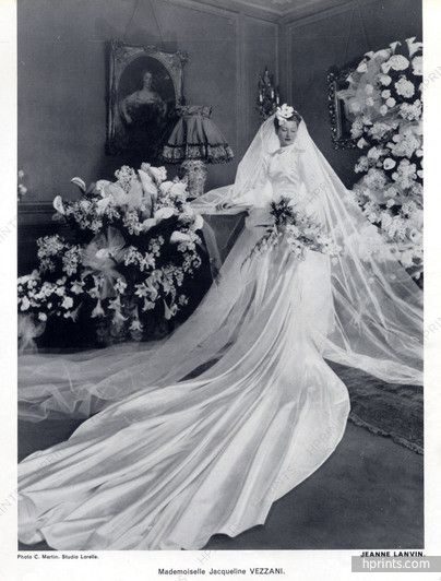 an old photo of a bride in her wedding dress