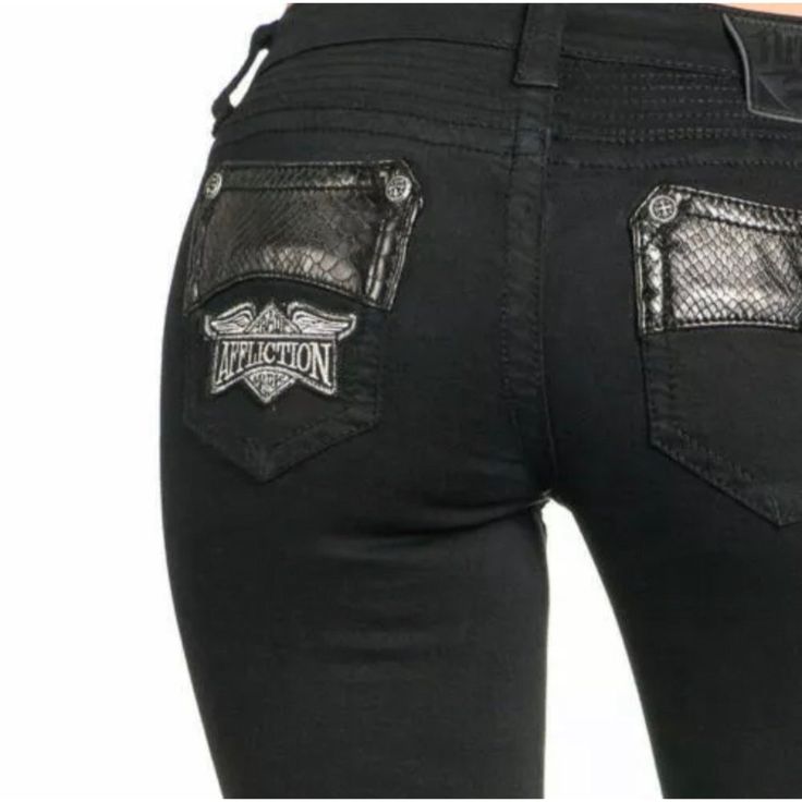 Affliction Women's Denim Jeans Raquel Avenge Black Embroidered Buckle $135 B37 Jeans With Patches, Many Pockets, Studs And Fabric Insertions Skinny Style Opening With A Zipper Form Fitting Jeans With Fabric Insertions Made Of Faux Leather On The Pockets In Front Fabric Insertions In The Knee Area And Embroidered Fabric Insertions Decorating The Legs In Front Dark Embroidery Along The Sides Style: Raquel Avenge In Black 111sk058 Material: 98% Cotton, 2% Spandex Fitted Black Jeans For Biker Events, Patches Fabric, Dark Embroidery, Affliction Jeans, Jeans With Patches, Fitting Jeans, Women's Denim Jeans, Embroidered Fabric, Women Denim Jeans