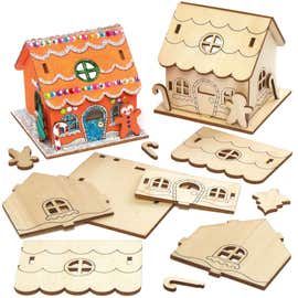 wooden cutouts of houses and gingerbread house