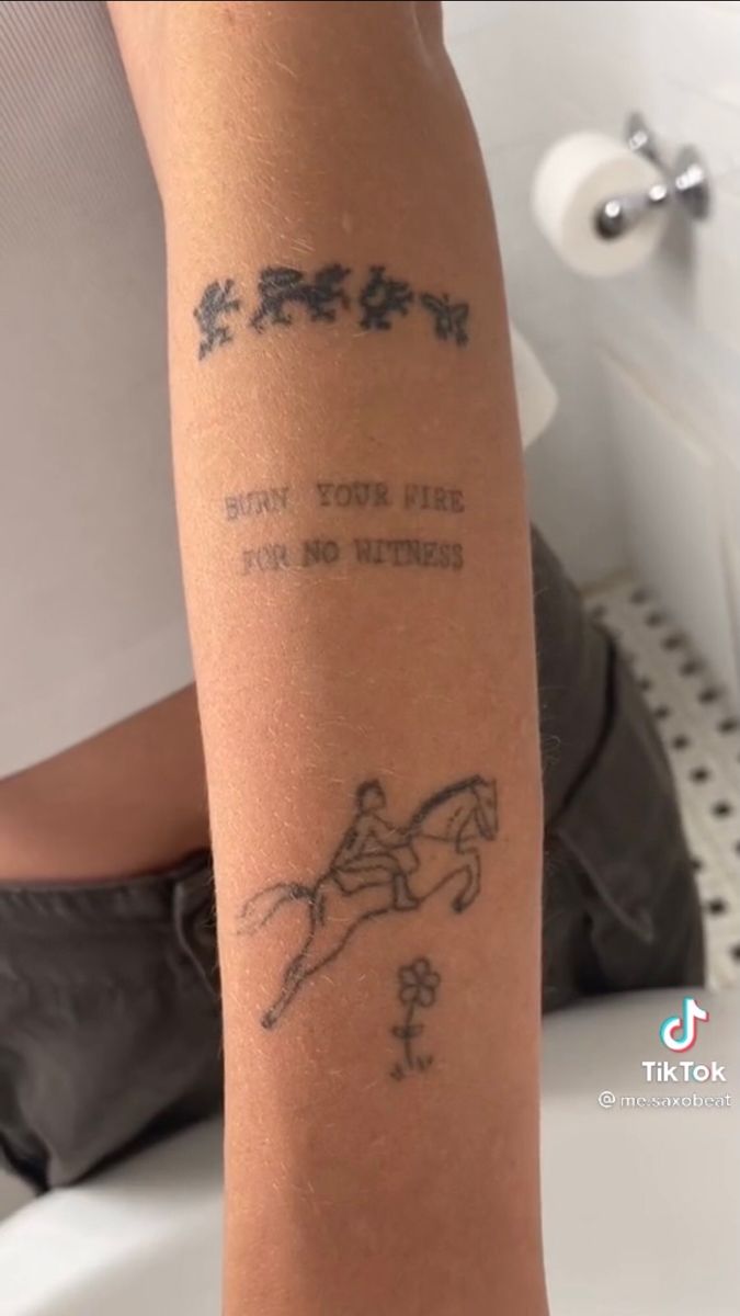 a person with a tattoo on their arm