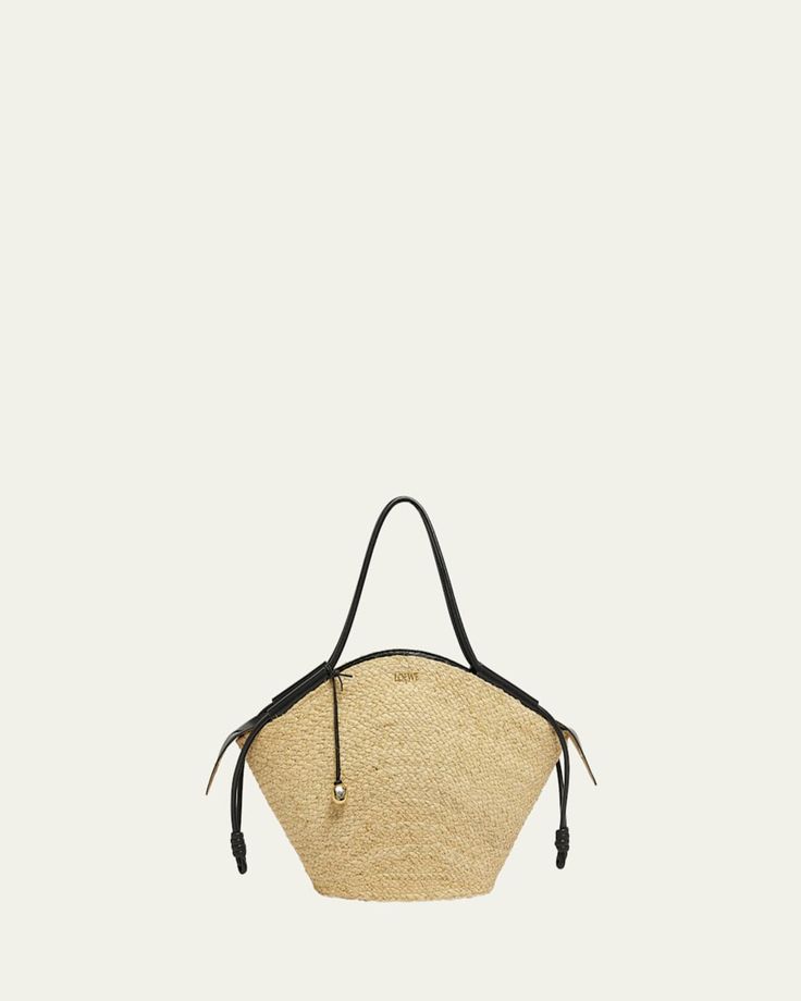 Loewe "Paseo" basket tote bag in raffia and leather     Rolled shoulder straps with Anagram pebble accent     Zip top closure     Interior, one slip pocket     Approx. 12.5"H x 22.6"W x 5.5"D    Made in Spain Luxury Straw Basket Bag With Detachable Handle, Luxury Basket Straw Bag With Detachable Handle, Luxury Basket Shoulder Bag With Braided Handles, Designer Straw Bag With Adjustable Strap In Natural Color, Designer Straw Bag With Adjustable Strap, Luxury Natural Satchel Bucket Bag, Luxury Straw Bag With Handle Drop For Travel, Luxury Natural Bucket Bag In Satchel Shape, Luxury Natural Color Satchel Bucket Bag