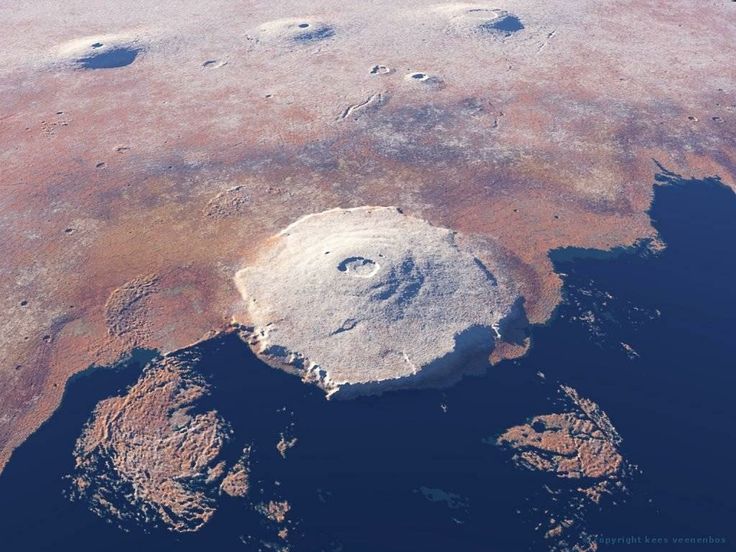 an aerial view of the earth with land, water and rocks in it's foreground