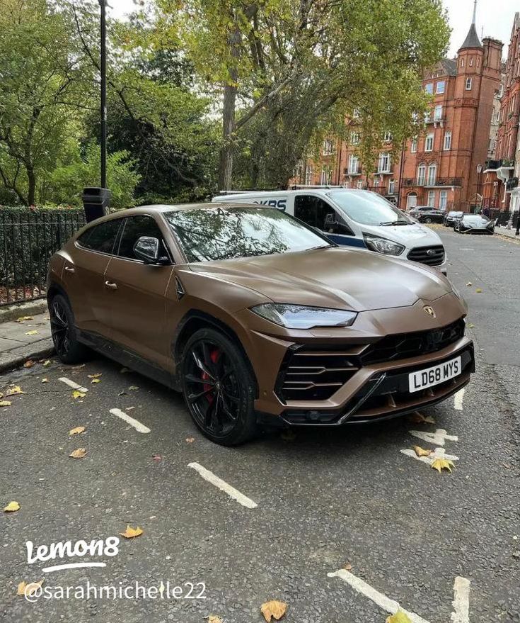 a brown sports car parked on the side of the road