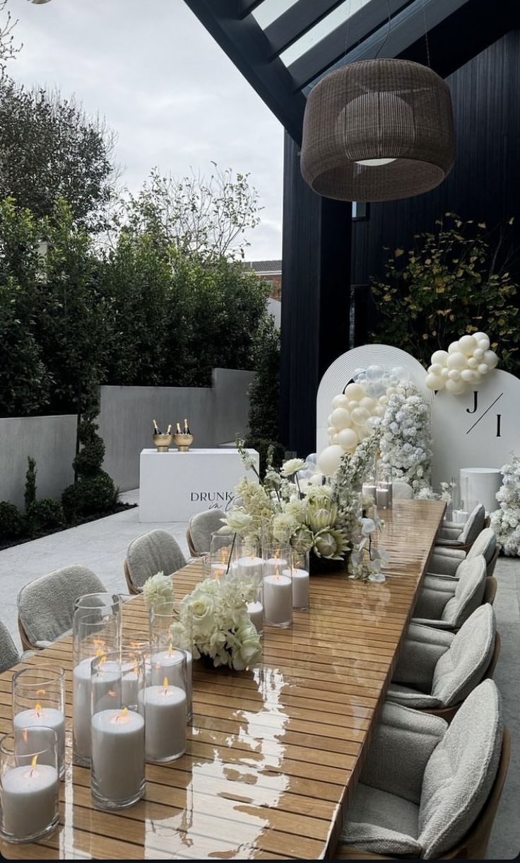 a long table with candles and flowers on it