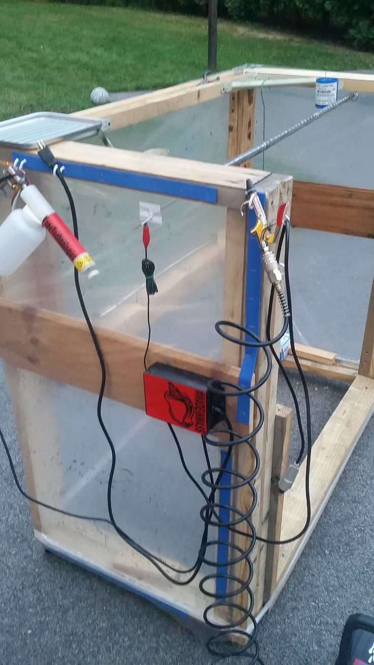 an unfinished glass box with wires attached to it