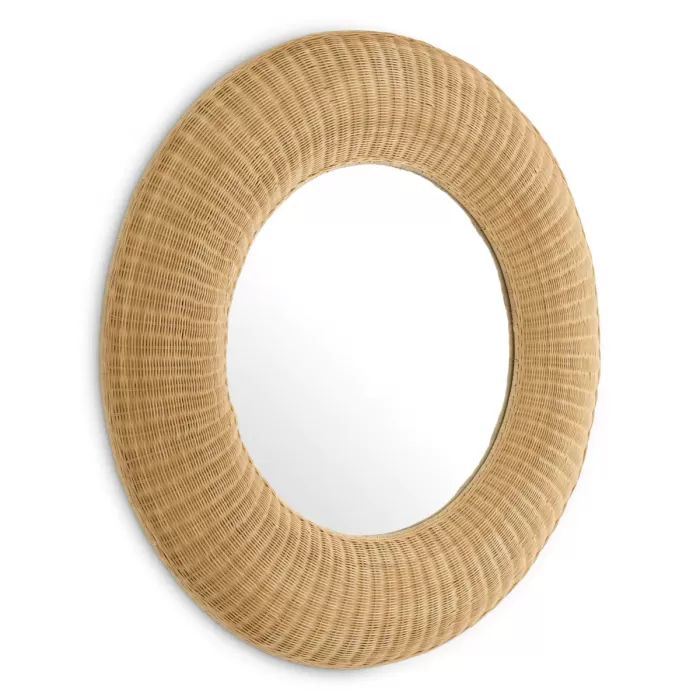 a round mirror on the wall with a wooden frame and wicker decoration around it