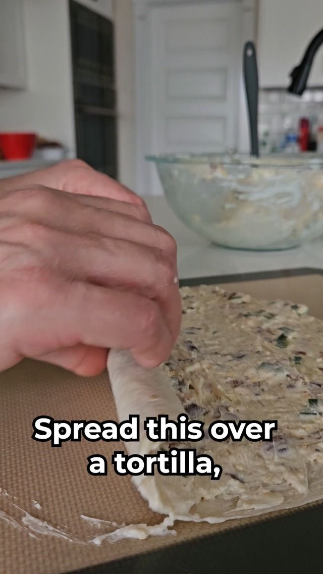 a person is spreading some food on top of a pan with the words spread this over a tortilla