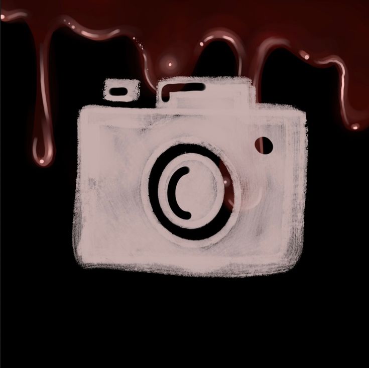 a digital camera with chocolate dripping over it