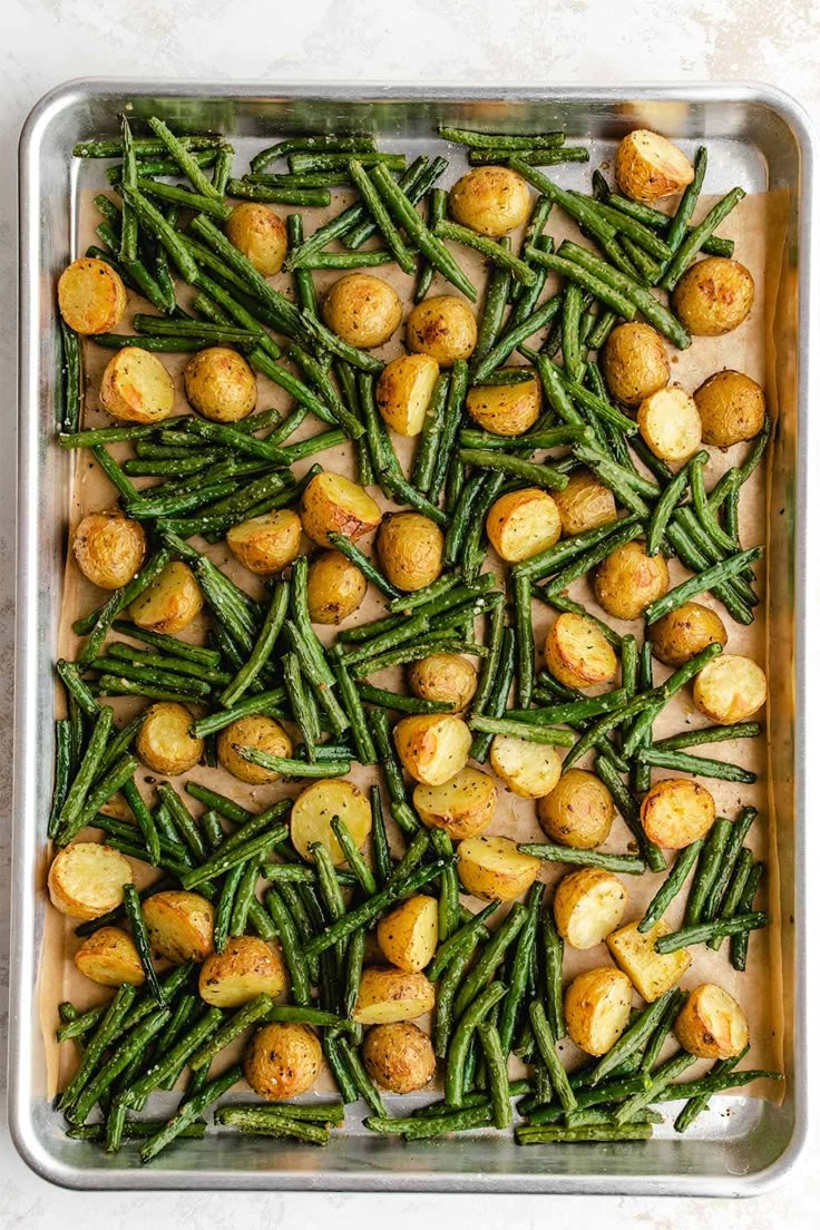 green beans and potatoes in a baking pan