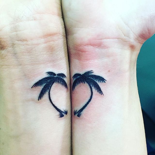 two palm trees on their wrist tattoo designs for women and men are shown in the shape of a heart