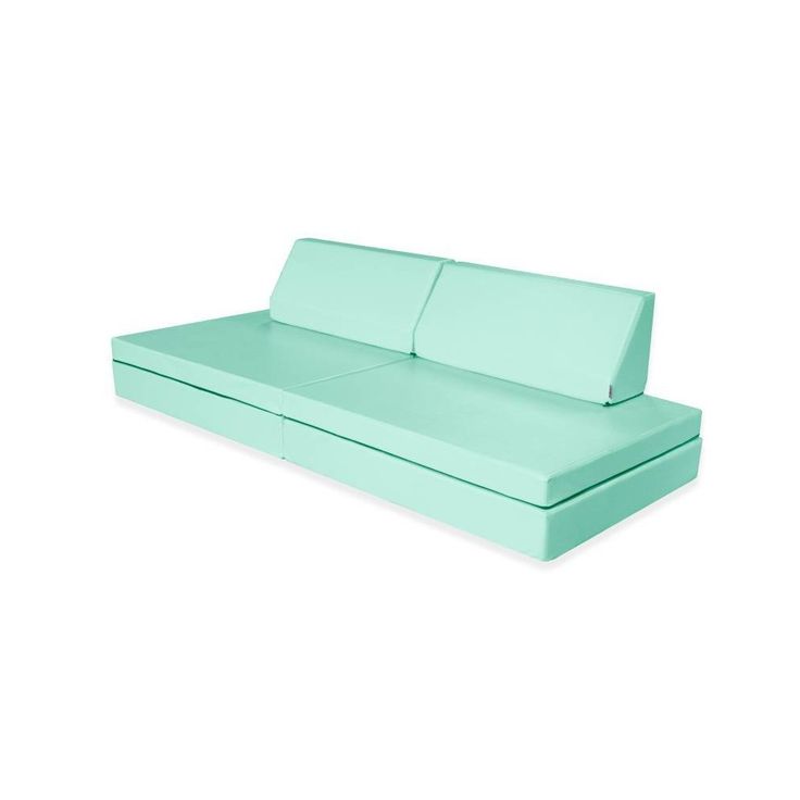 a light green couch with two seats on it