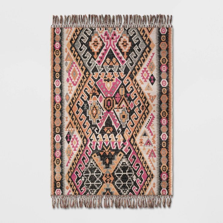 a multicolored rug with fringes on it