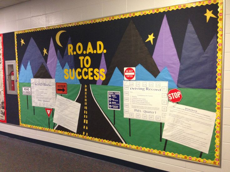 a bulletin board with road to success written on it in front of a school hallway