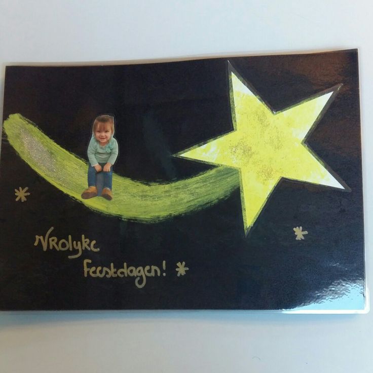 a child's drawing of a boy sitting on a crescent moon with stars above it